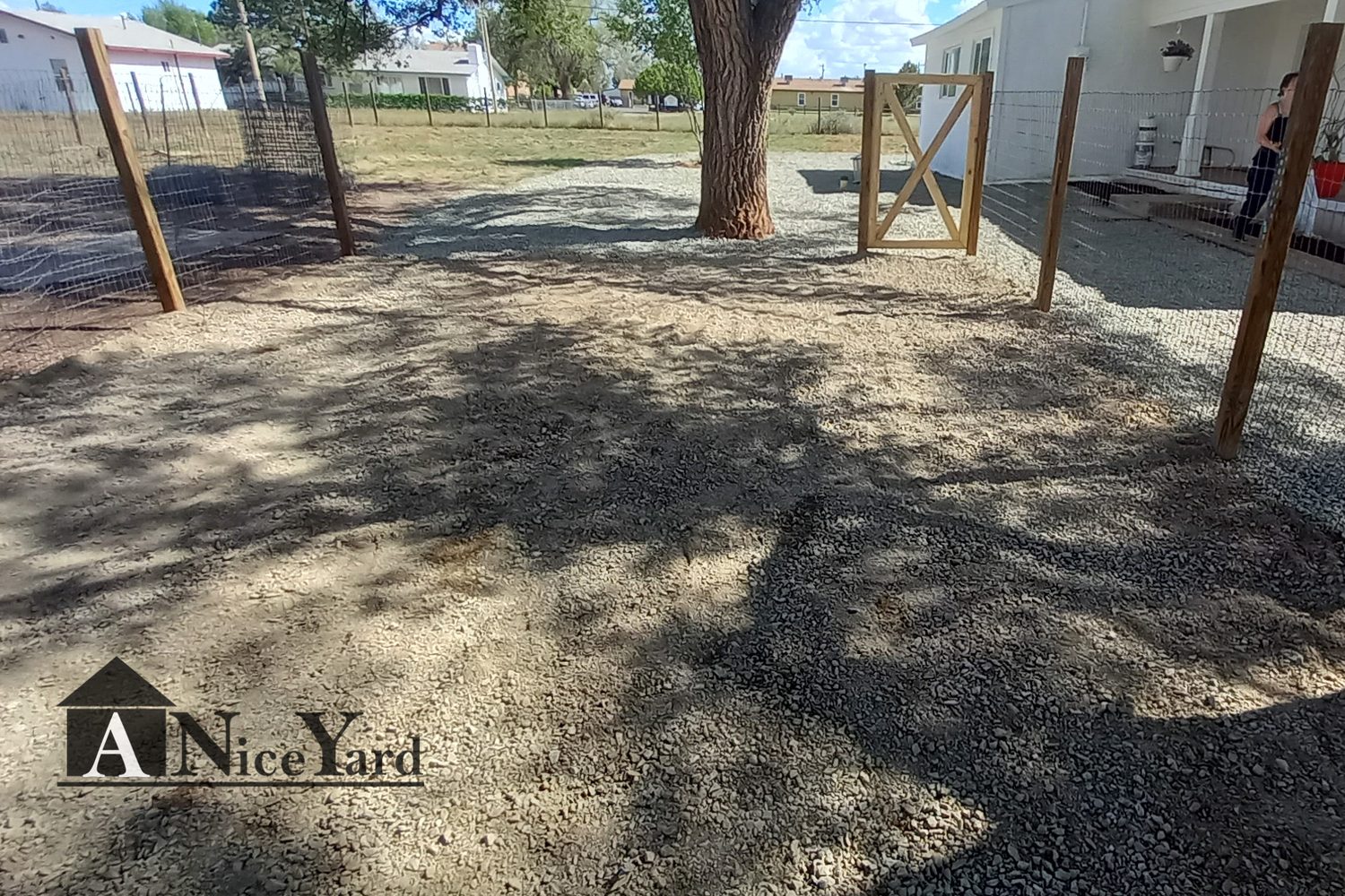 After — Roll-off in, debris out, and a tidy graveled finish.